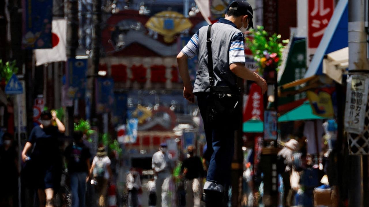 Passersby are seen through a heat haze during hot weather at Sugamo district in Tokyo. Credit: Reuters Photo