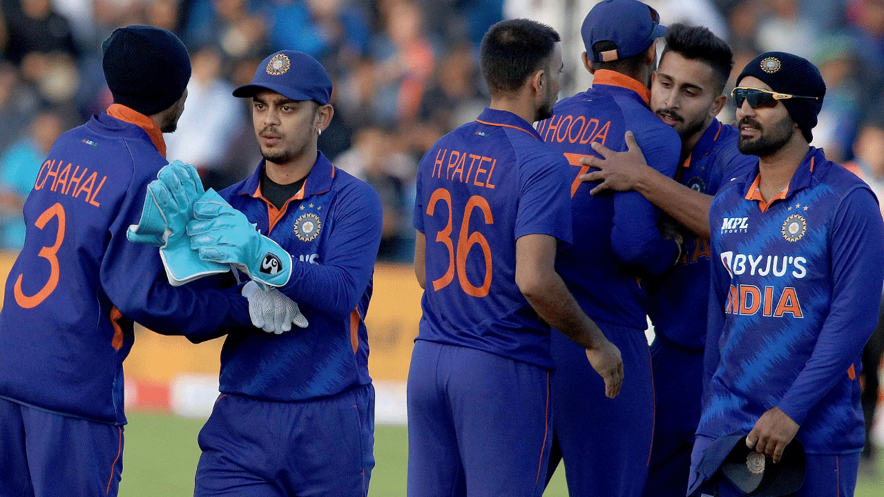 India's Yuzvendra Chahal (L) congratulates India's Ishan Kishan (2L) as they celebrate with teammates after winning the second Twenty20 International cricket match between Ireland and India. Credit: AFP Photo