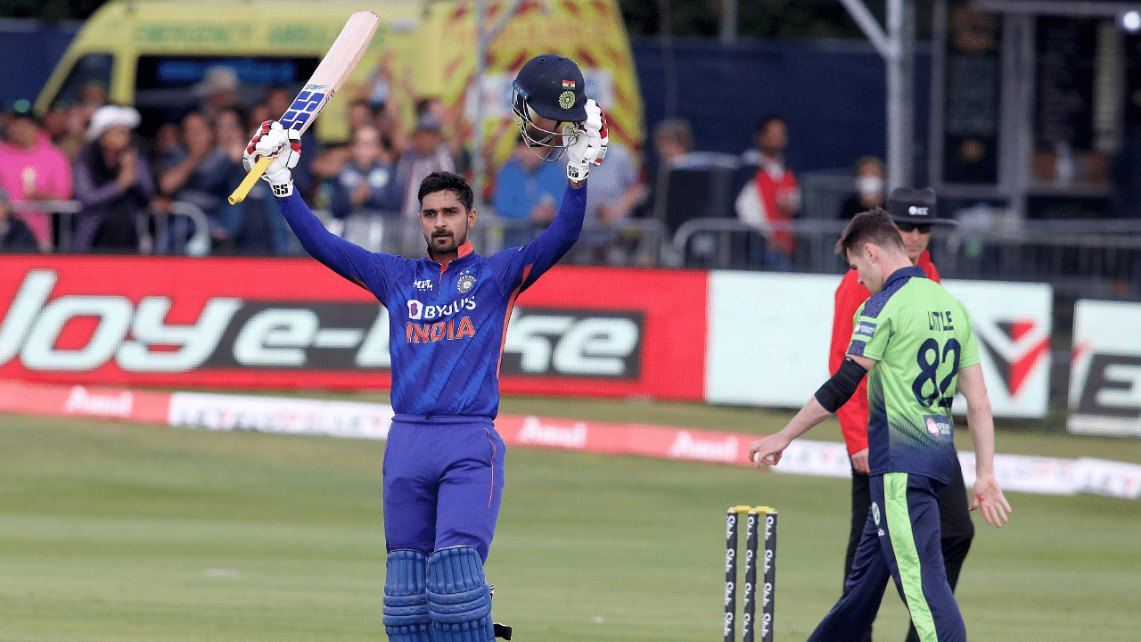 Deepak Hooda celebrates his century during the second Twenty20 International cricket match between Ireland and India at Malahide cricket club, in Dublin. Credit: AFP Photo