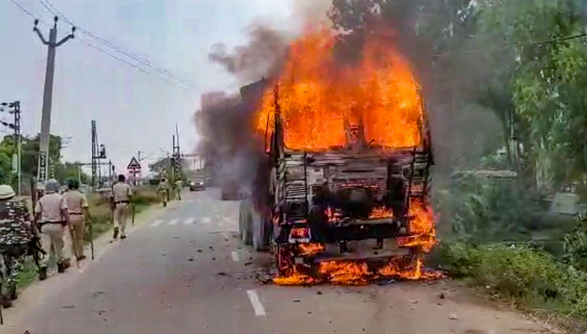 A transport vehicle after it was set on fire by protestors during Bihar Bandh, called to protest against Centre's 'Agnipath' scheme, in Jehanabad. Credit: PTI Photo