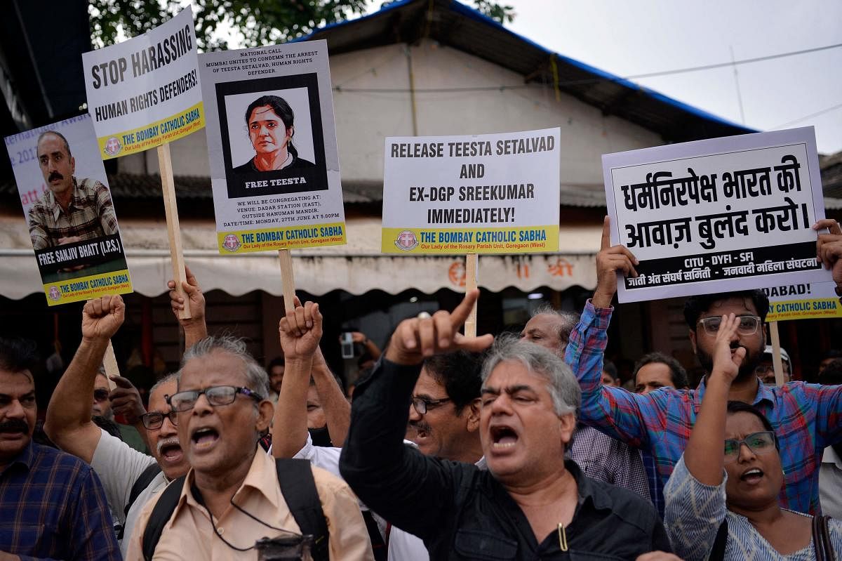 Demonstrators hold placards and shout slogans during a protest in Mumbai on June 27, 2022. - Protests were held in several Indian cities on June 27 over the arrest of rights activist Teesta Setalvad. Credit: PTI Photo