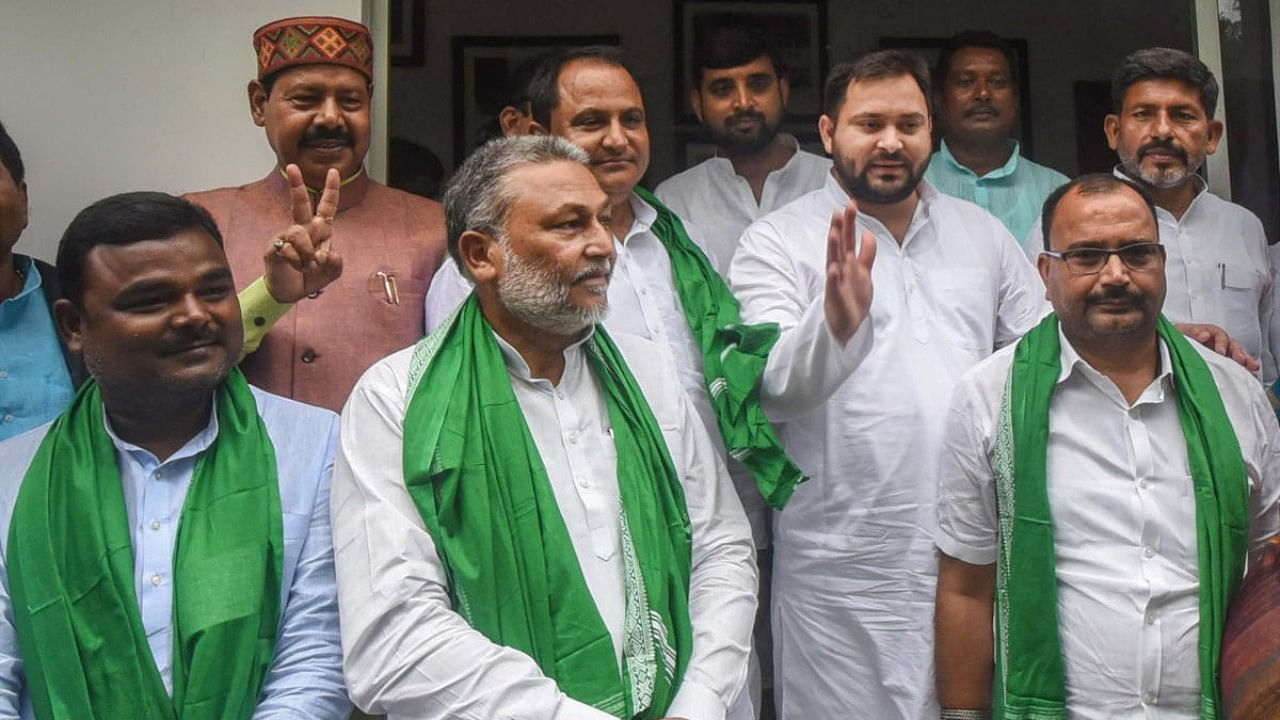 Rashtriya Janata Dal (RJD) leader Tejashwi Yadav with four All India Majlis-e-Ittehad-ul-Muslimeen (AIMIM) MLAs as they join RJD during a press conference, in Patna. Credit: PTI Photo