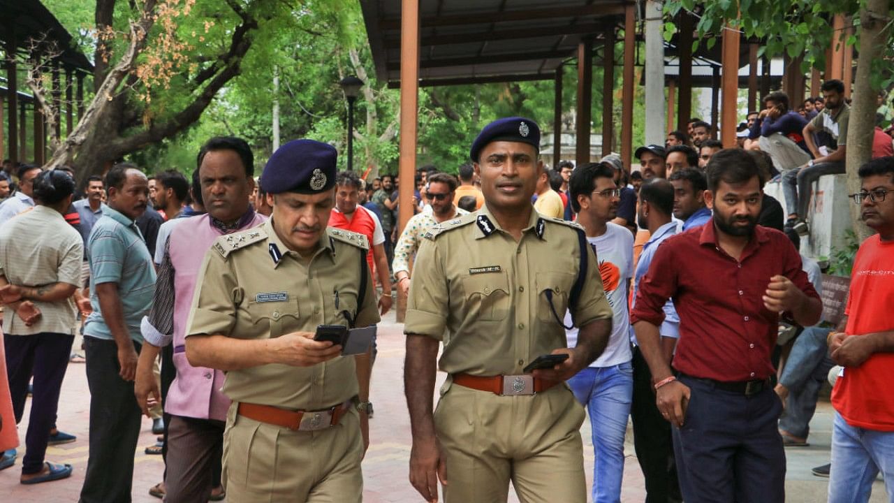 Senior police officials during the funeral of tailor Kanhaiya Lal in Udaipur. Credit: PTI Photo