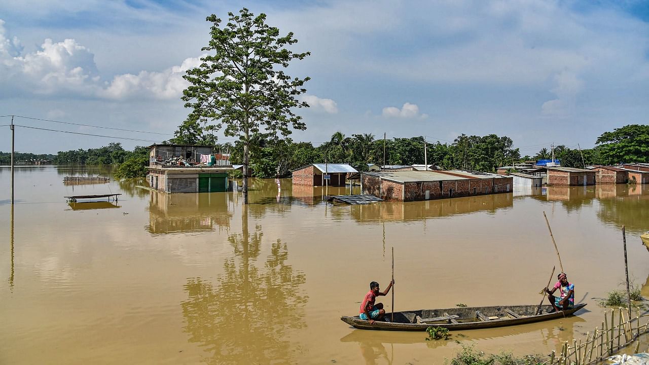 Families who have lost their members during the flood are also unable to take the bodies to the crematoria because of the high flood waters. Credit: PTI Photo