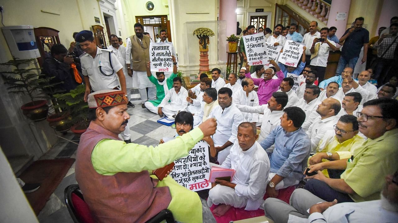 Opposition legislators stage a 'dharna' over Agnipath scheme outside the Speaker's office at the Bihar Assembly. Credit: PTI Photo