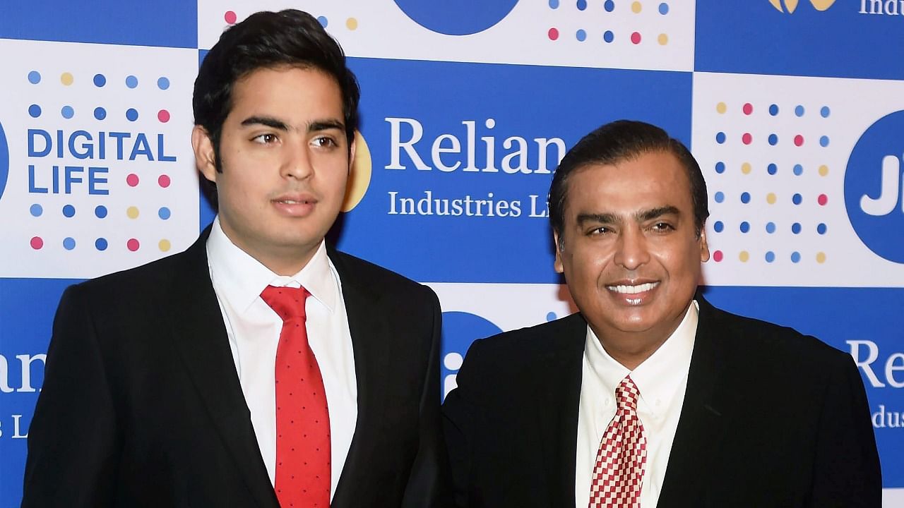 Mukesh Ambani, Chairman, Reliance Industries Ltd. with his son Akash Ambani at the company's annual general meeting in Mumbai. Credit: PTI file photo