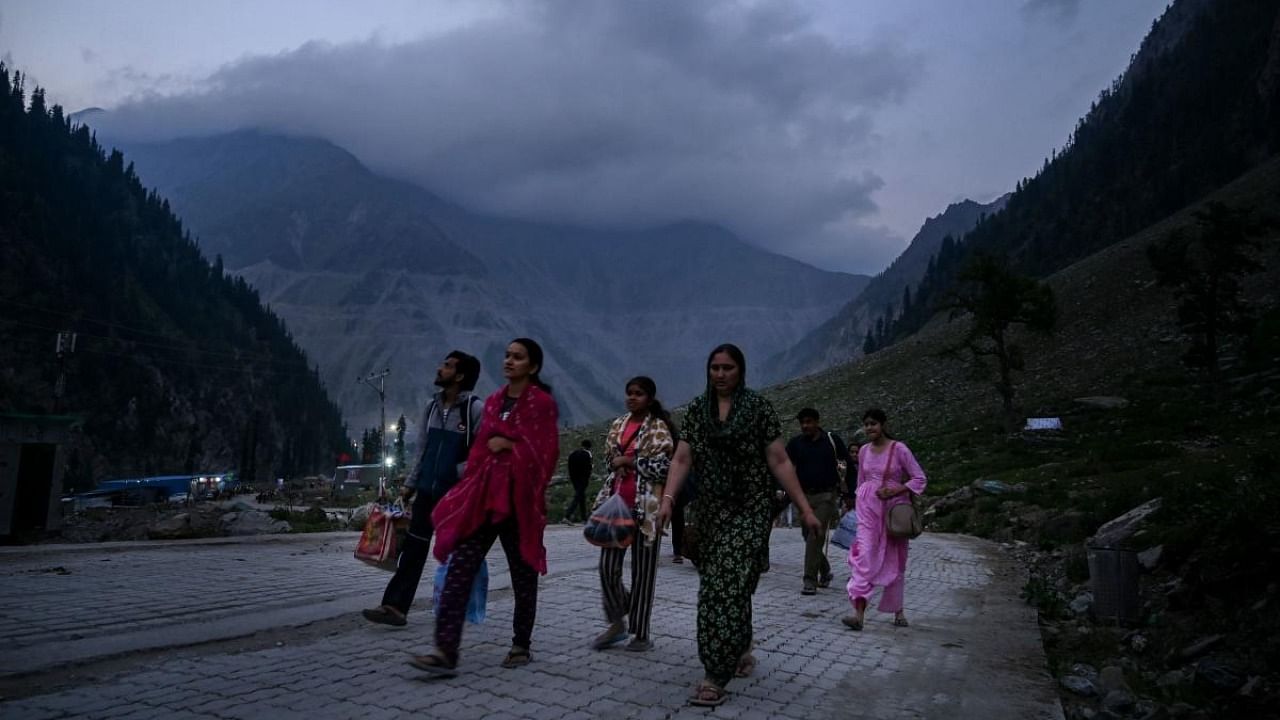 Hindu piligrims arrive at the Baltal Base Camp before proceeding to the cave shrine of Amarnath, in Baltal on June 29, 2022, as part of the annual Amarnath pilgrimage. Credit: AFP Photo