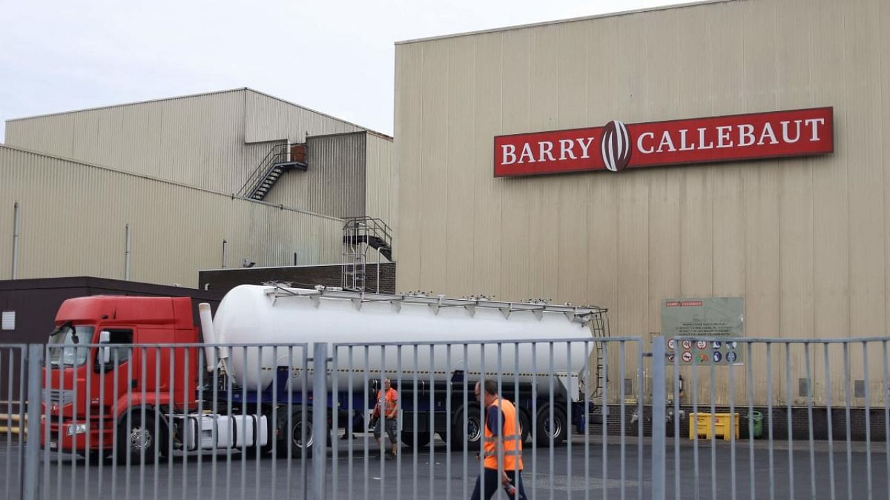 Employees walk at Barry Callebaut production site in Wieze, near Brussels. Credit: AFP Photo