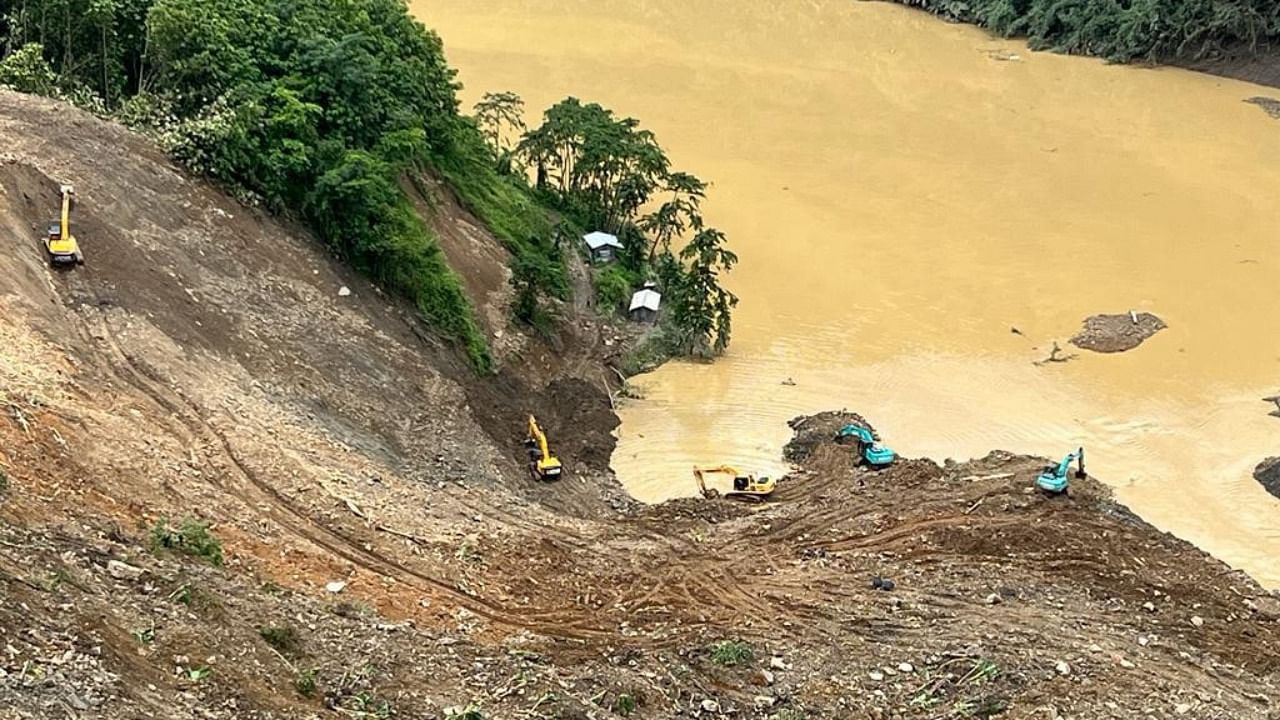 Rescue operation underway for the third consecutive day after a massive landslide hit the Tupul railway construction camp in Noney District of Manipur. Credit: IANS Photo