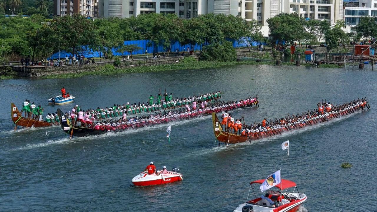Rowers on traditional wooden boats from Kerala known as snake boats participate in the Champions Boat League held at the backwaters of Kochi in India's southwest state of Kerala. Credit: AFP Photo