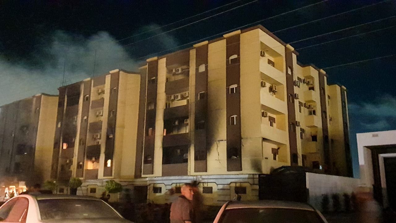 This picture taken early on July 2, 2022 shows a view of the building used by Libya's Tobruk-based parliament building in the country's east, lit up by protesters who broke inside while demonstrating against deteriorating living conditions and political deadlock. Credit: AFP Photo