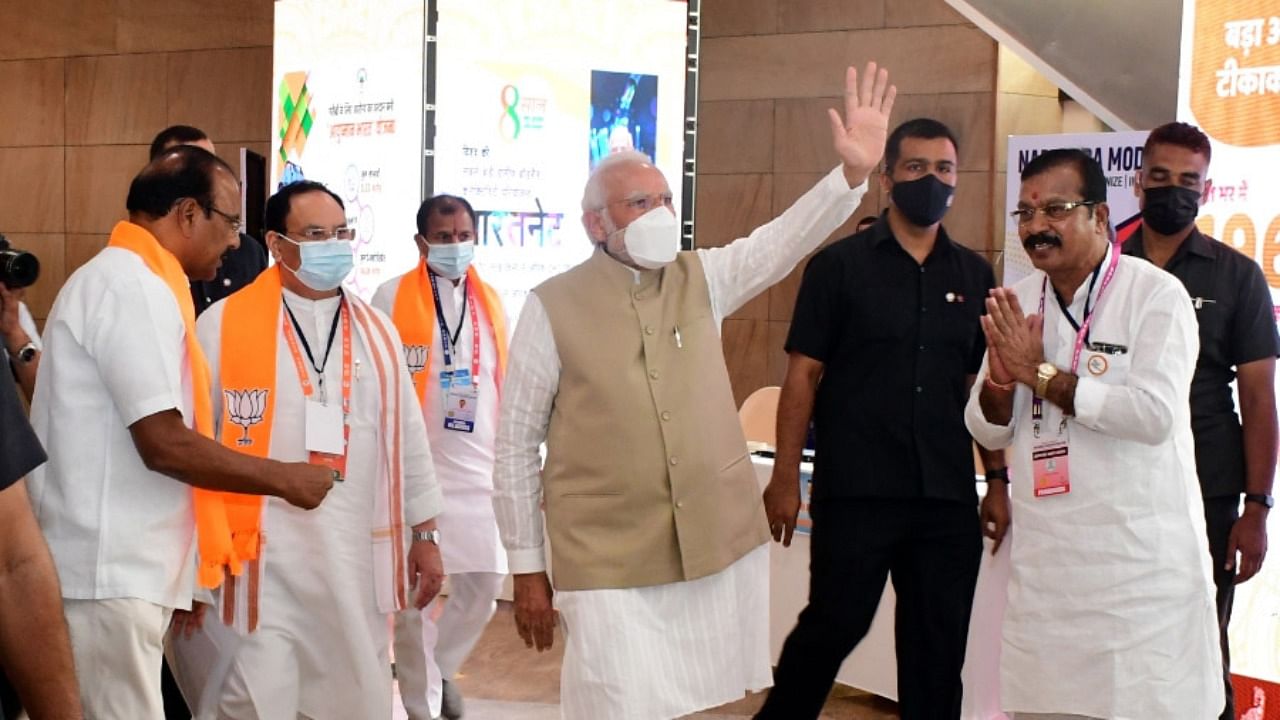 Prime Minister Narendra Modi waves as he arrives to attend BJP's National Executive Meeting at HICC in Hyderabad. Credit: PTI Photo