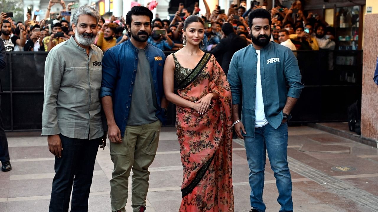 Indian actors N T Rama Rao Jr. (R), Alia Bhatt (2R), Ram Charan (2L) and director S S Rajamouli. Credit: AFP Photo