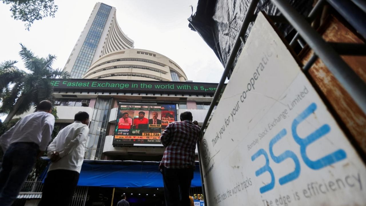 People standing outside the Bombay Stock Exchange building in Mumbai. Credit: Reuters File Photo