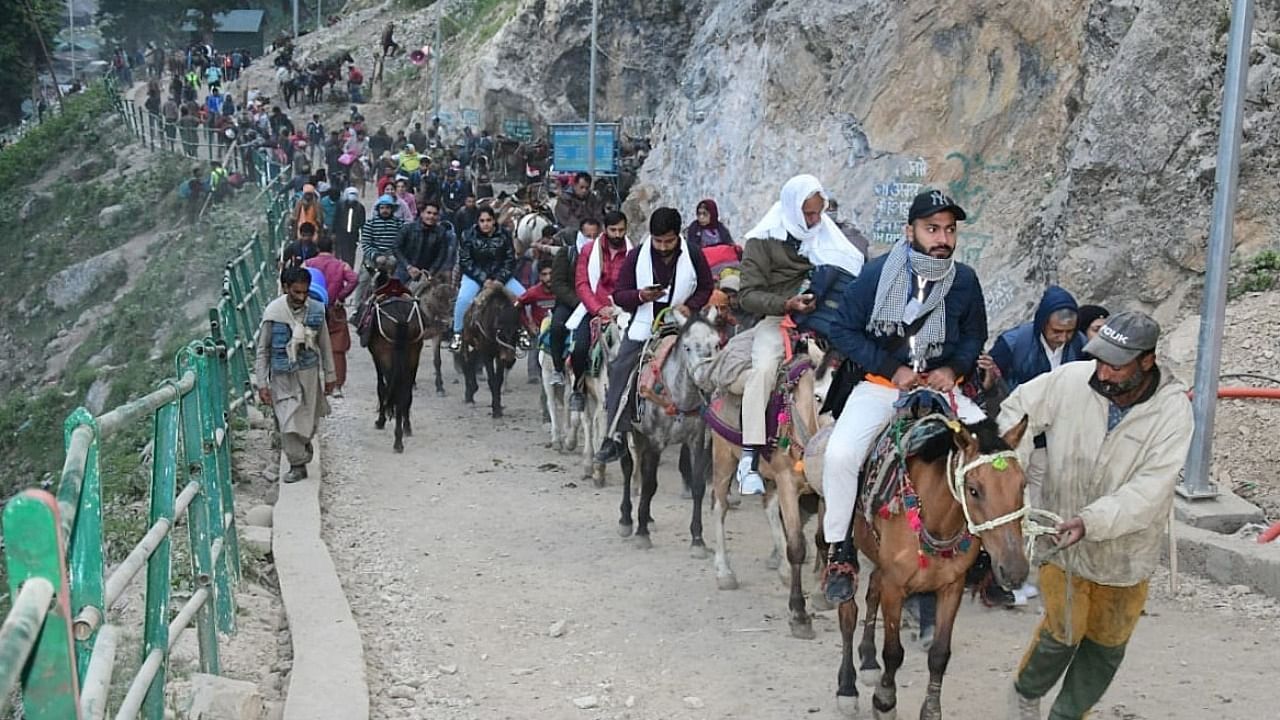 Hindu devotees leave for the Amarnath Yatra annual pilgrimage to an icy Himalayan cave, in Nuwun, Pahalgam. Credit: IANS Photo