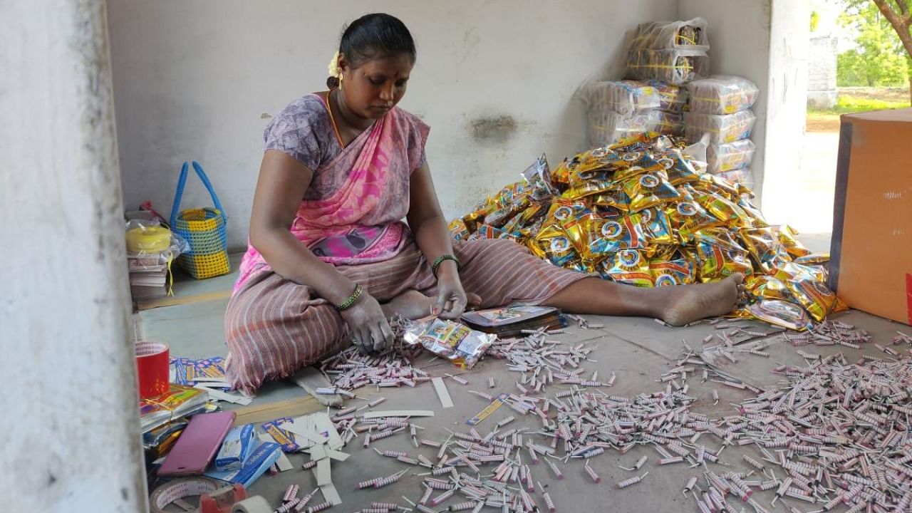 Workers take pride in the speed at which they pack firecrackers, such as the bijlis, in pouches. Credit: DH Photo