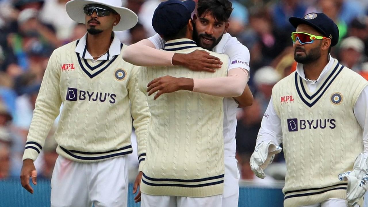India's Mohammed Siraj (2nd R) celebrates with teammates after taking the wicket of England's Sam Billings during play on Day 3 of the fifth cricket Test match between England and India. Credit: AFP Photo