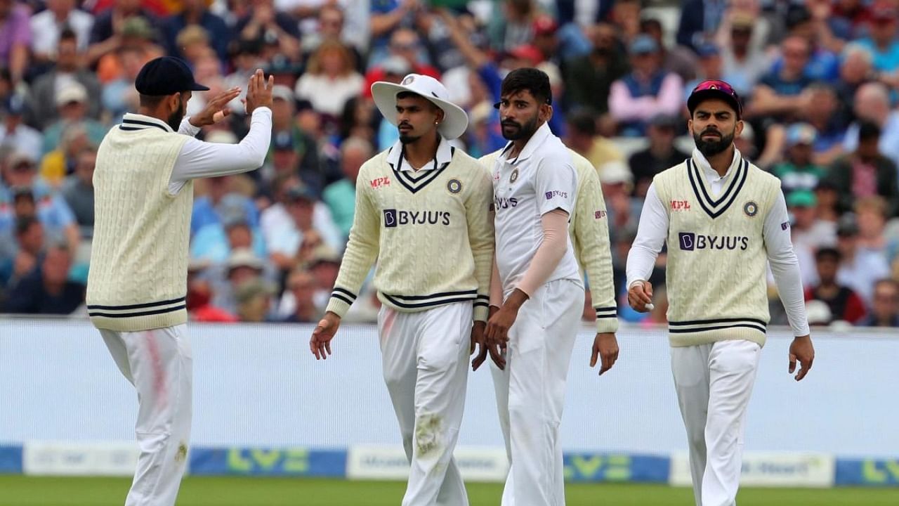 Shreyas Iyer (2nd L) celebrates with teammates after taking a catch to dismiss England's Matthew Potts and end England's Innings on Day 3 of the fifth cricket Test match between England and India at Edgbaston. Credit: AFP Photo