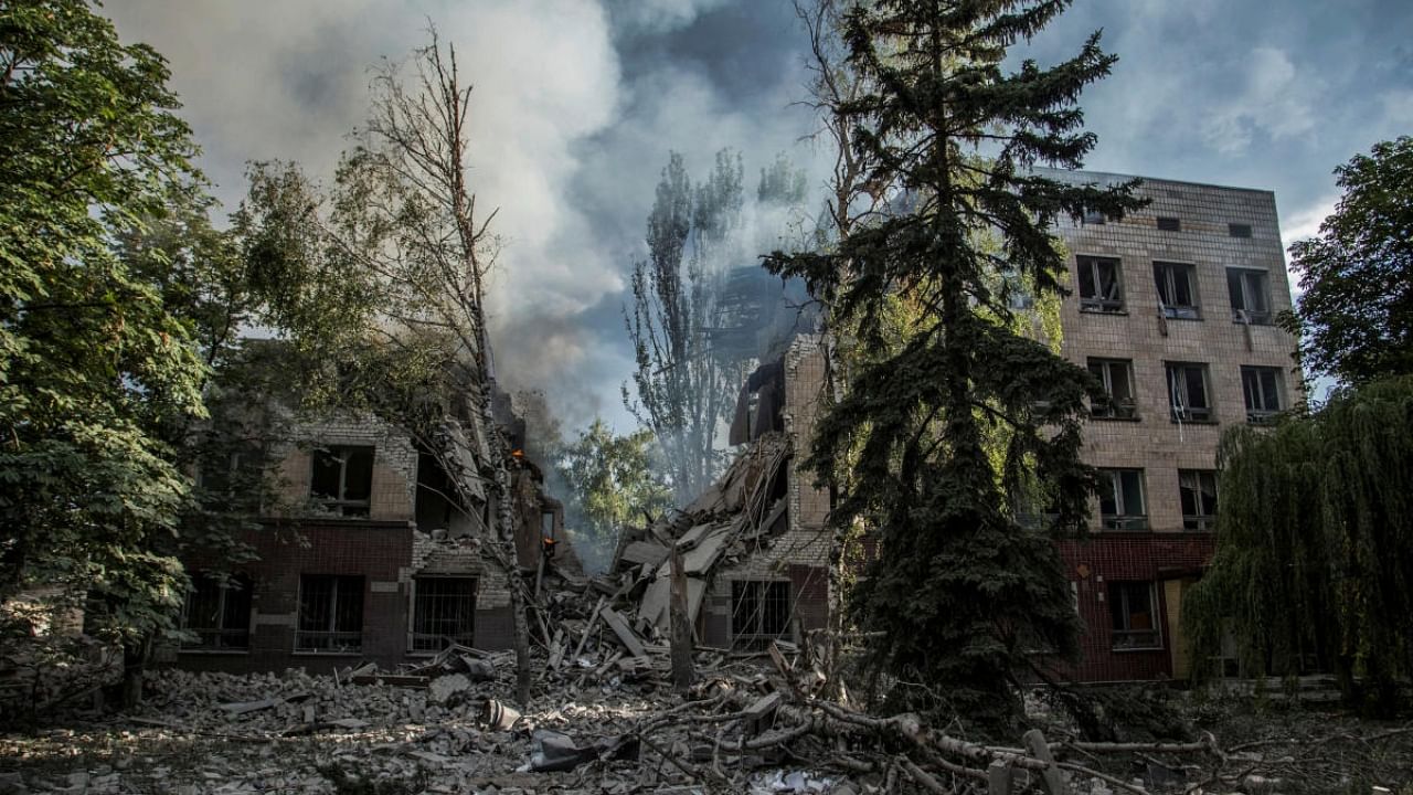 Smoke rises over the remains of a building destroyed by a military strike, as Russia's attack on Ukraine continues, in Lysychansk, Luhansk region, Ukraine June 17, 2022. Credit: Reuters
