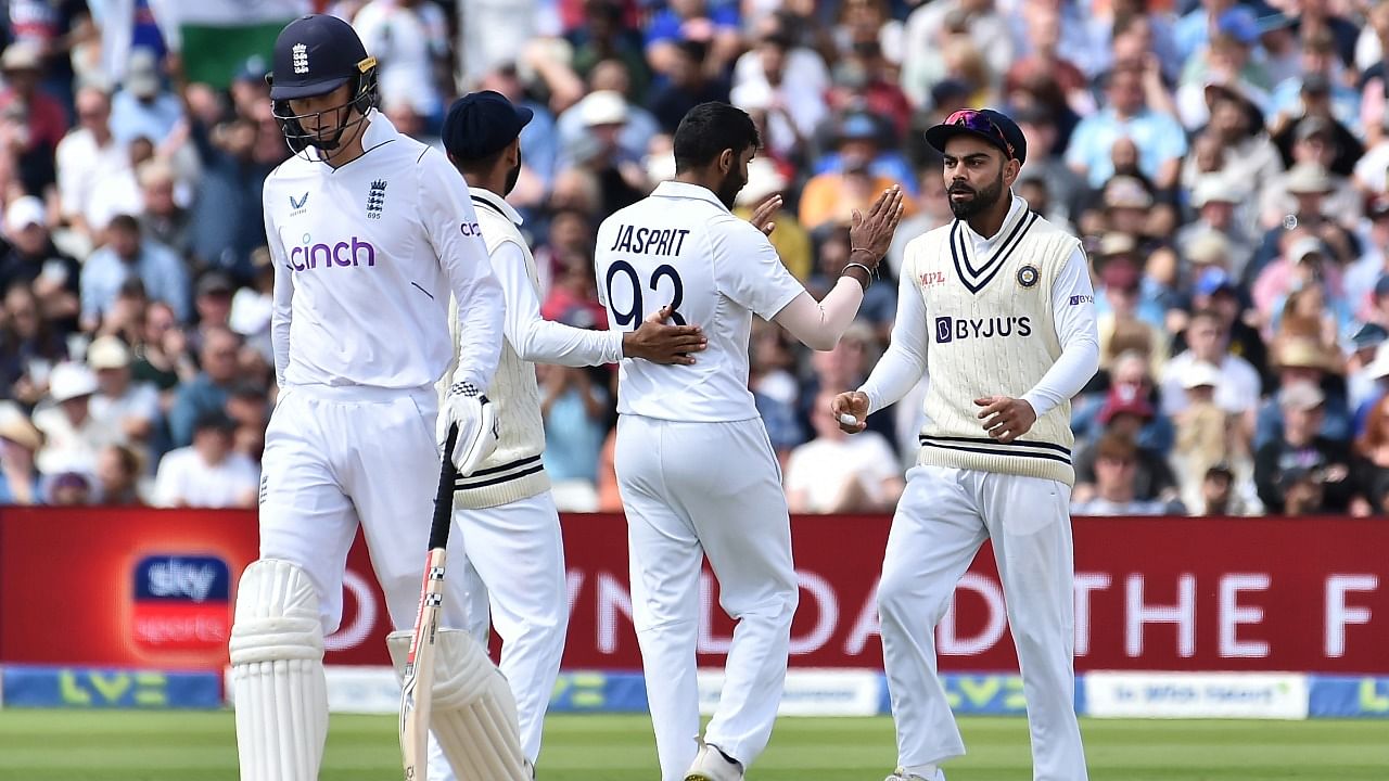 India's Jasprit Bumrah, second right, celebrates with teammates the dismissal of England's Zak Crawley. Credit: AP Photo