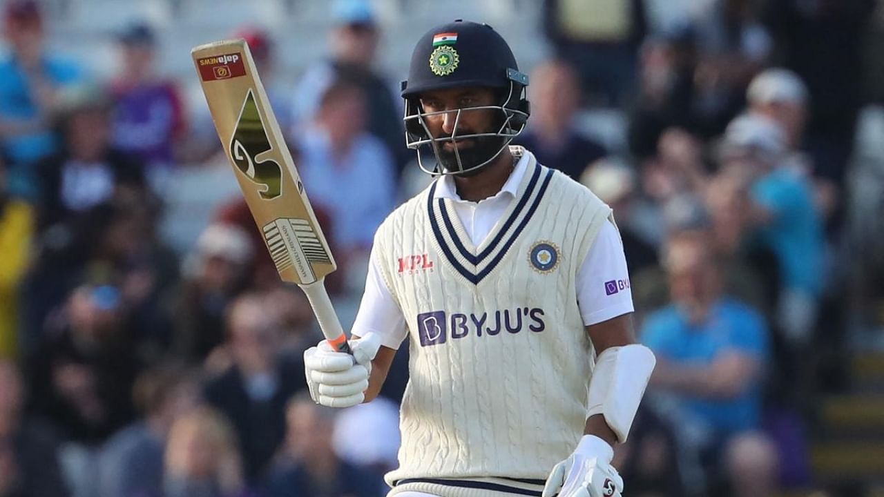 Cheteshwar Pujara celebrates reaching 50 during play on Day 3 of the fifth cricket Test match between England and India at Edgbaston, Birmingham in central England on July 3, 2022. Credit: AFP Photo