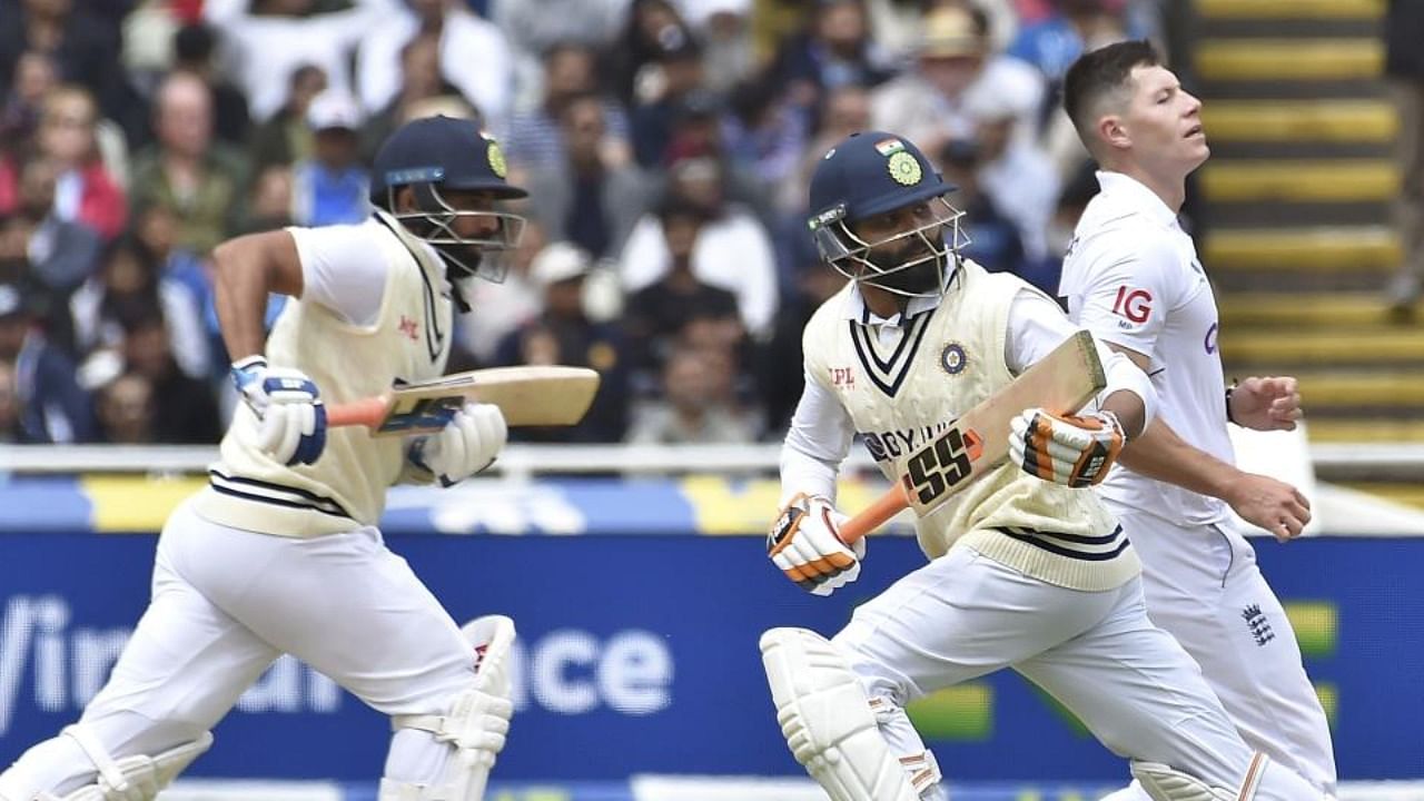 India's Mohammed Shami, left, and Ravindra Jadeja run between the wickets to score during the fourth day of the fifth cricket Test match between England and India at Edgbaston in Birmingham, England, Monday, July 4, 2022. Credit: AP/PTI Photo