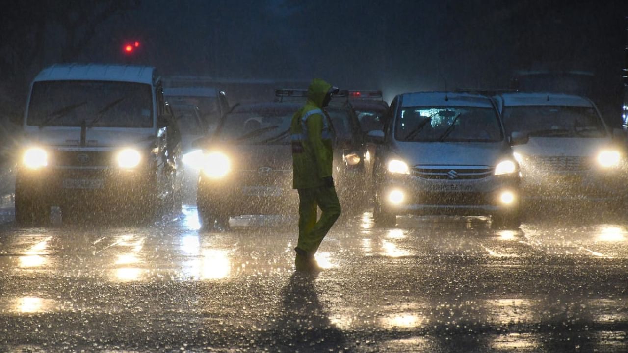 Vehicles ply on a road amid monsoon rains, in Mumbai, Monday, July 4, 2022. Credit: PTI Photo