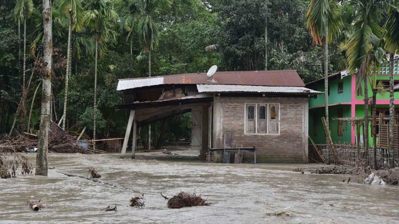 A view of damaged house due to flood following heavy rainfall, in Bajali district of Assam, Wednesday, June 29, 2022. Credit: IANS Photo