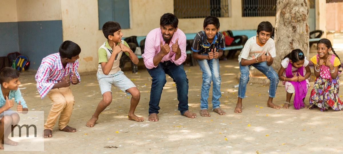 Children engage with student volunteers at the Makkala Jagriti centres.  