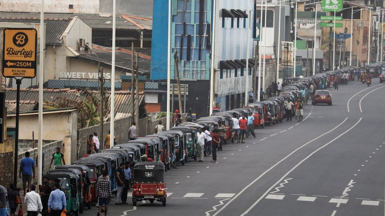 Three-wheelers queue to buy petrol due to fuel shortage, amid the country's economic crisis. Credit: Reuters Photo