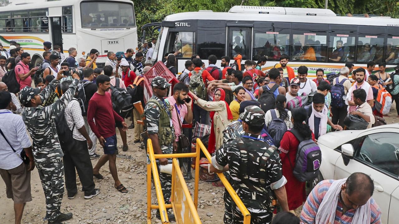 Pilgrims leave for Kashmir during the Amarnath Yatra 2022, in Jammu. Credit: PTI Photo