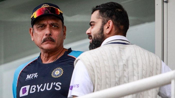 Virat Kohli (R), and Ravi Shastri. Credit: AP File Photo