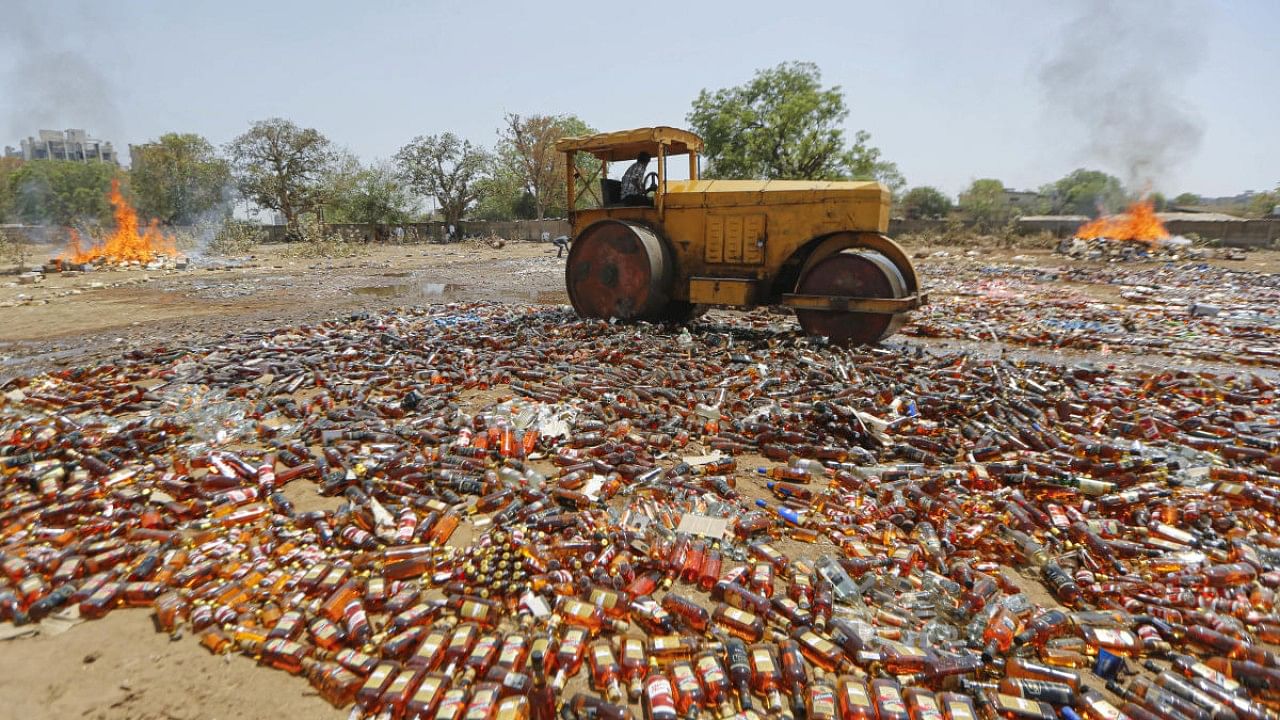 File photo of liquor bottles destroyed in Ahmedabad. Credit: PTI File Photo