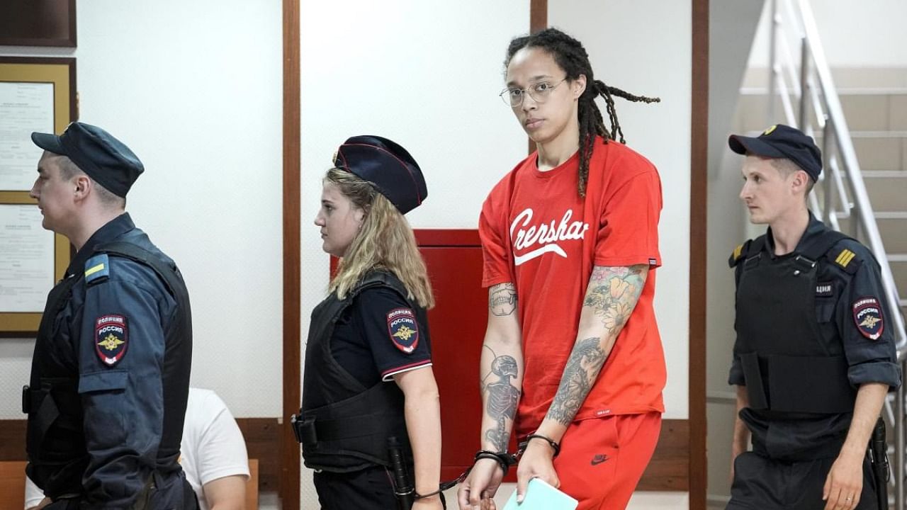 WNBA star and two-time Olympic gold medalist Brittney Griner is escorted to a courtroom for a hearing, in Khimki outside Moscow. Credit: AP/PTI Photo