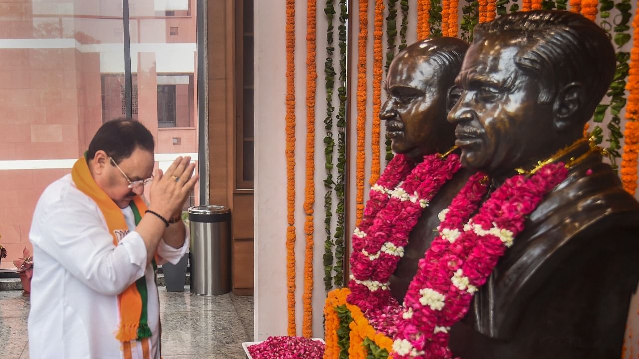 BJP National President J.P. Nadda pays floral tributes to Dr Shyama Prasad Mukherjee on his birth anniversary at BJP headquarters. Credit: PTI Photo