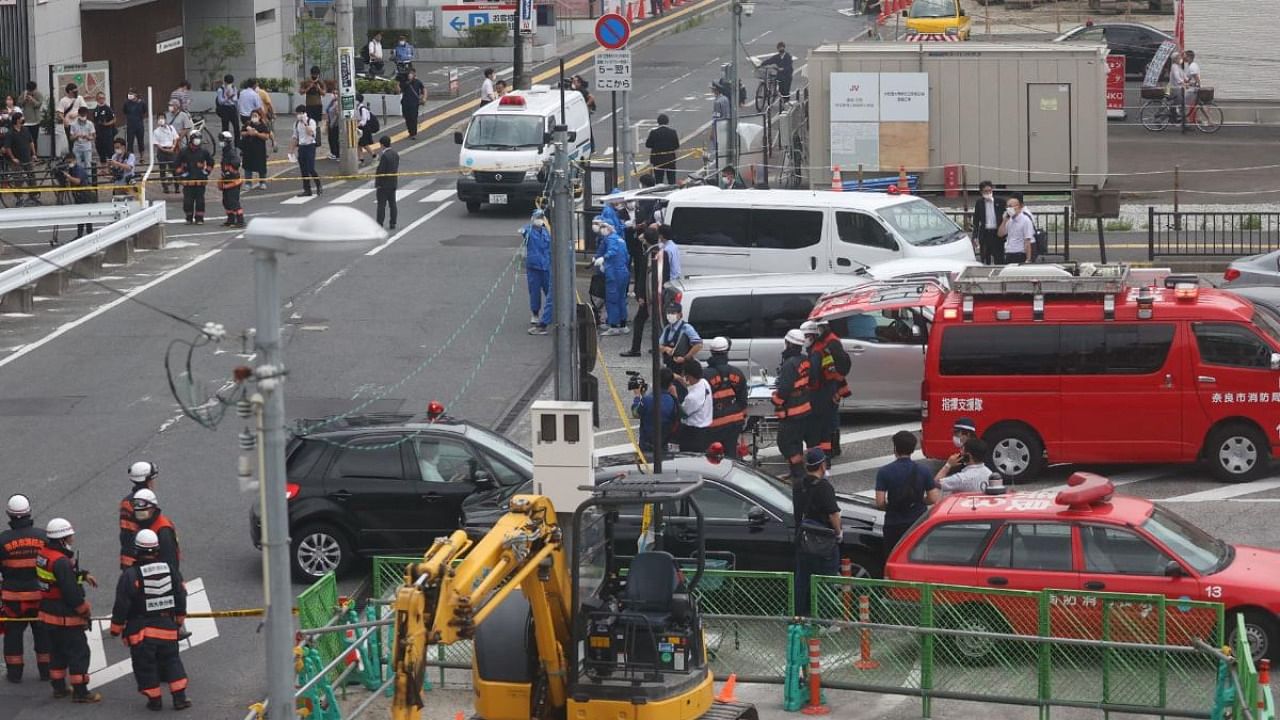 A general view shows workers at the scene after an attack on Japan's former prime minister Shinzo Abe at Kintetsu Yamato-Saidaiji station square in Nara on July 8, 2022. Credit: AFP Photo