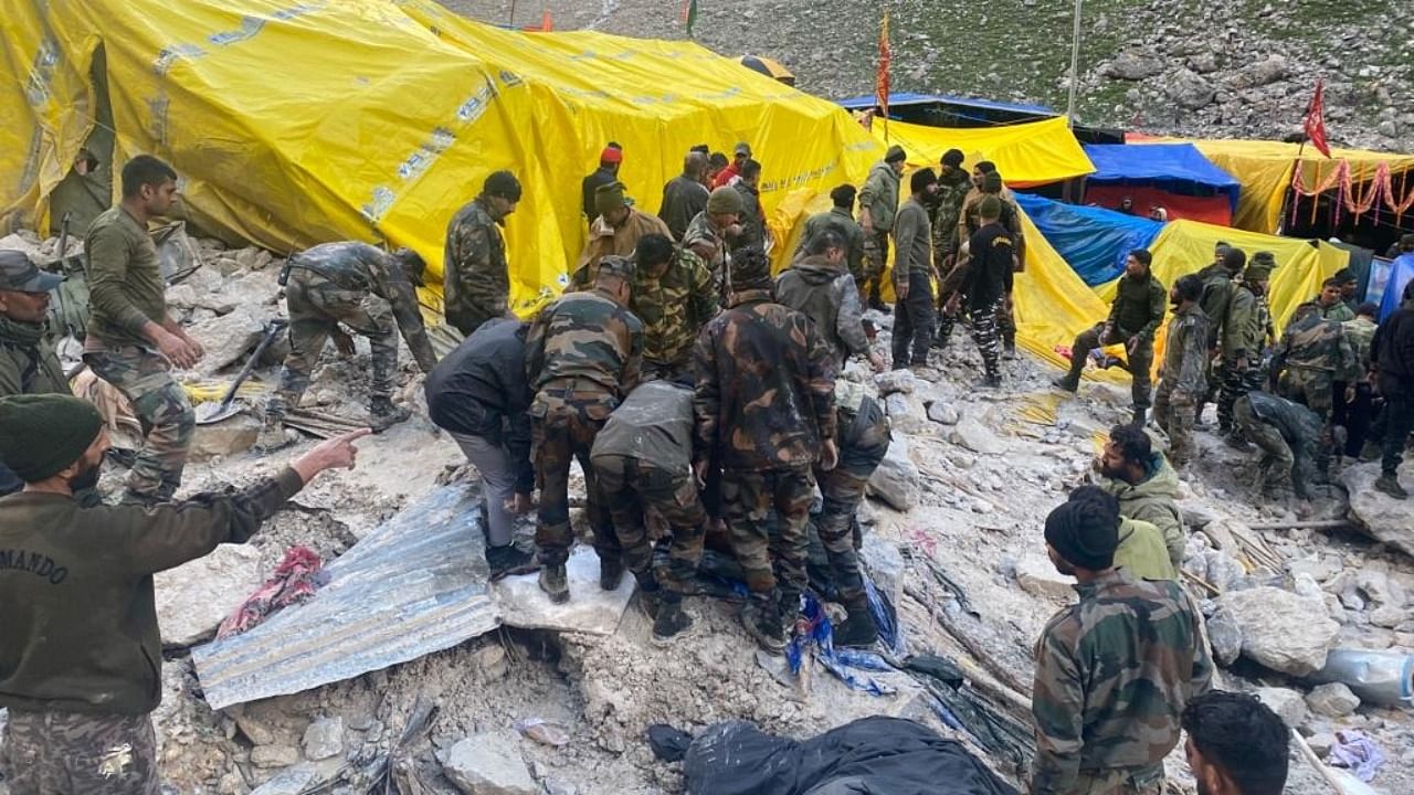 Security personnel during a rescue operation after a cloudburst hit Baltal area, which houses a base camp for the Amarnath pilgrimage, in Ganderbal district. Credit: IANS Photo