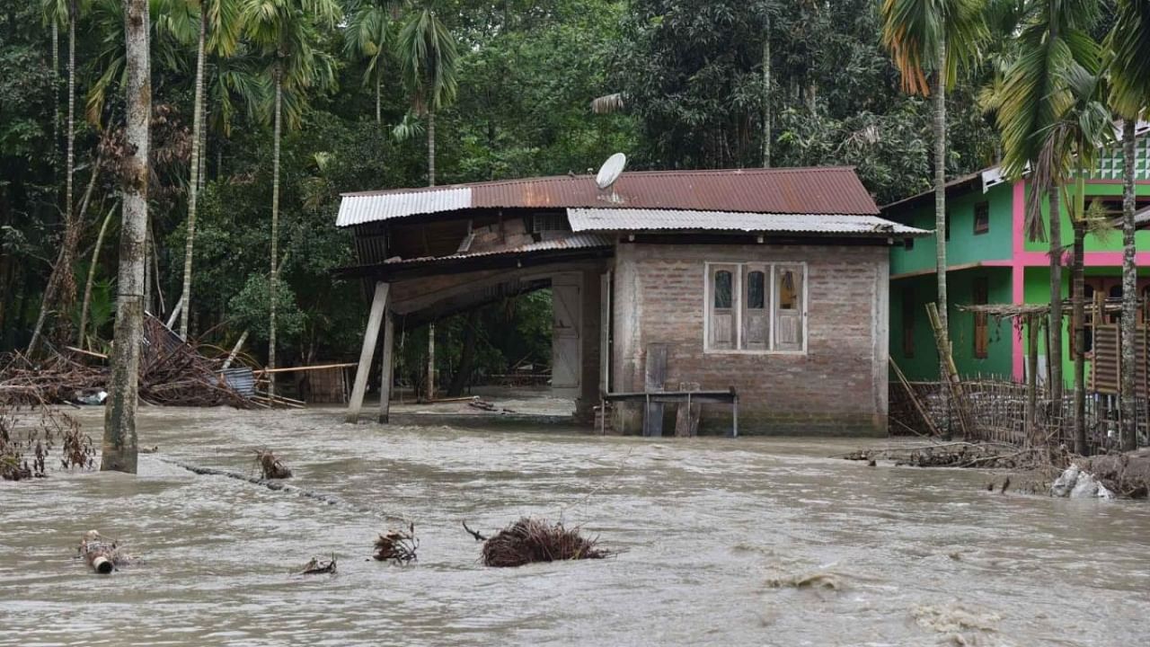 A view of damaged house due to flood following heavy rainfall, in Bajali district of Assam. Credit: IANS Photo