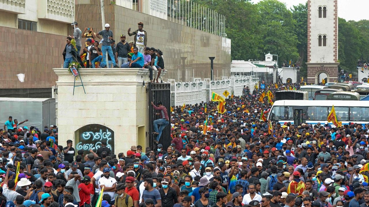 Protestors demanding the resignation of Sri Lanka's President Gotabaya Rajapaksa gather inside the compound of Sri Lanka's Presidential Palace in Colombo. Credit: AFP Photo