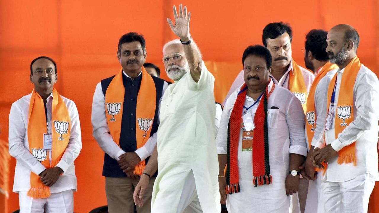 Prime Minister Narendra Modi waves towards supporters during a public meeting, in Hyderabad, on July 3. Credit: PTI Photo
