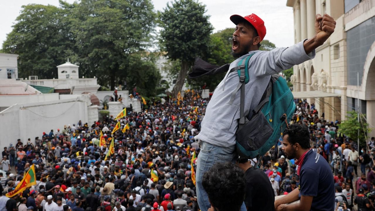 Demonstrators protest inside the President's House premises, after President Gotabaya Rajapaksa fled, amid the country's economic crisis, in Colombo. Credit: Reuters photo