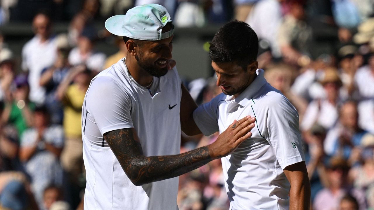 Australia's Nick Kyrgios (L) congratulates Serbia's Novak Djokovic for his victory during their men's singles final tennis match. Credit: AFP Photo