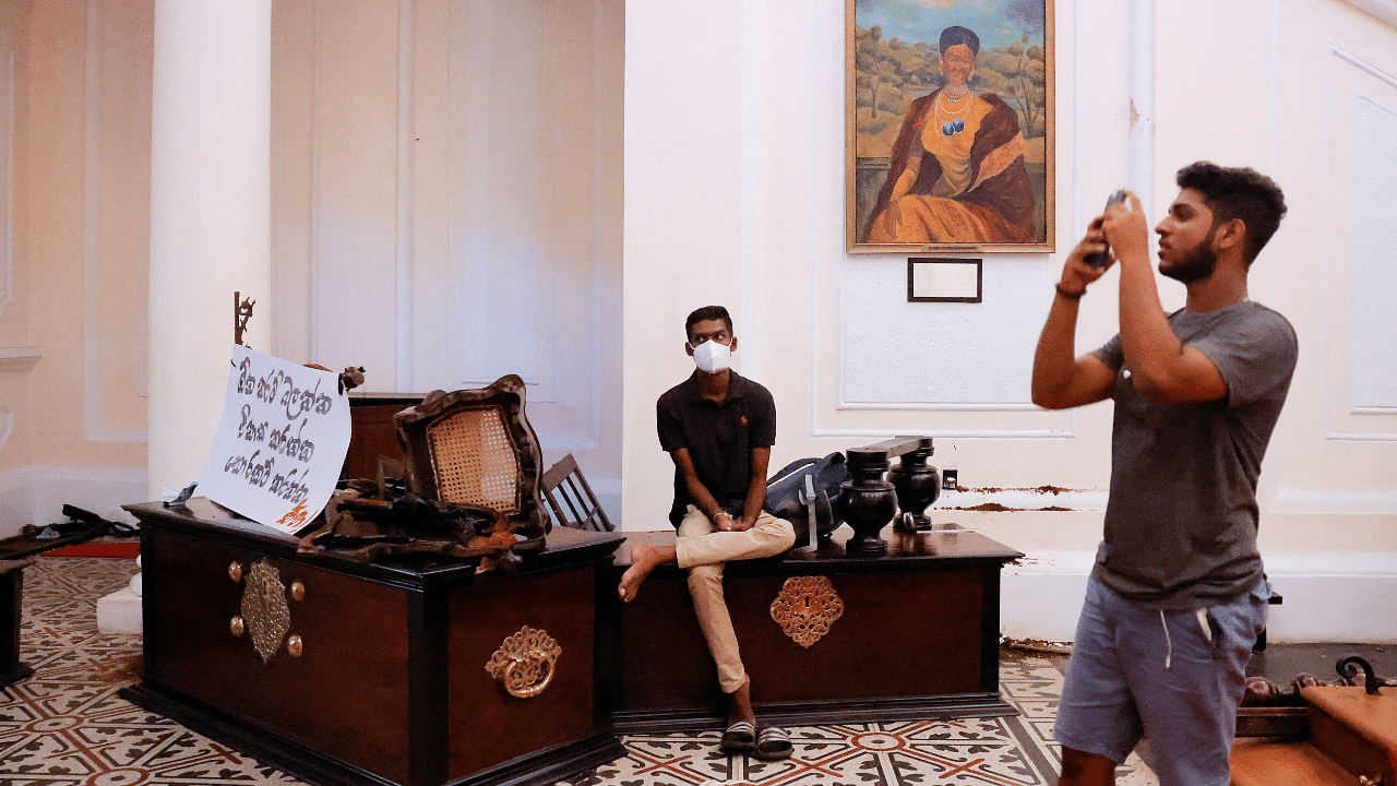 Demonstrators enter the Presidential Secretariat and President's House after Sri Lanka's President Rajapaksa fled, in Colombo. Credit: Reuters Photo