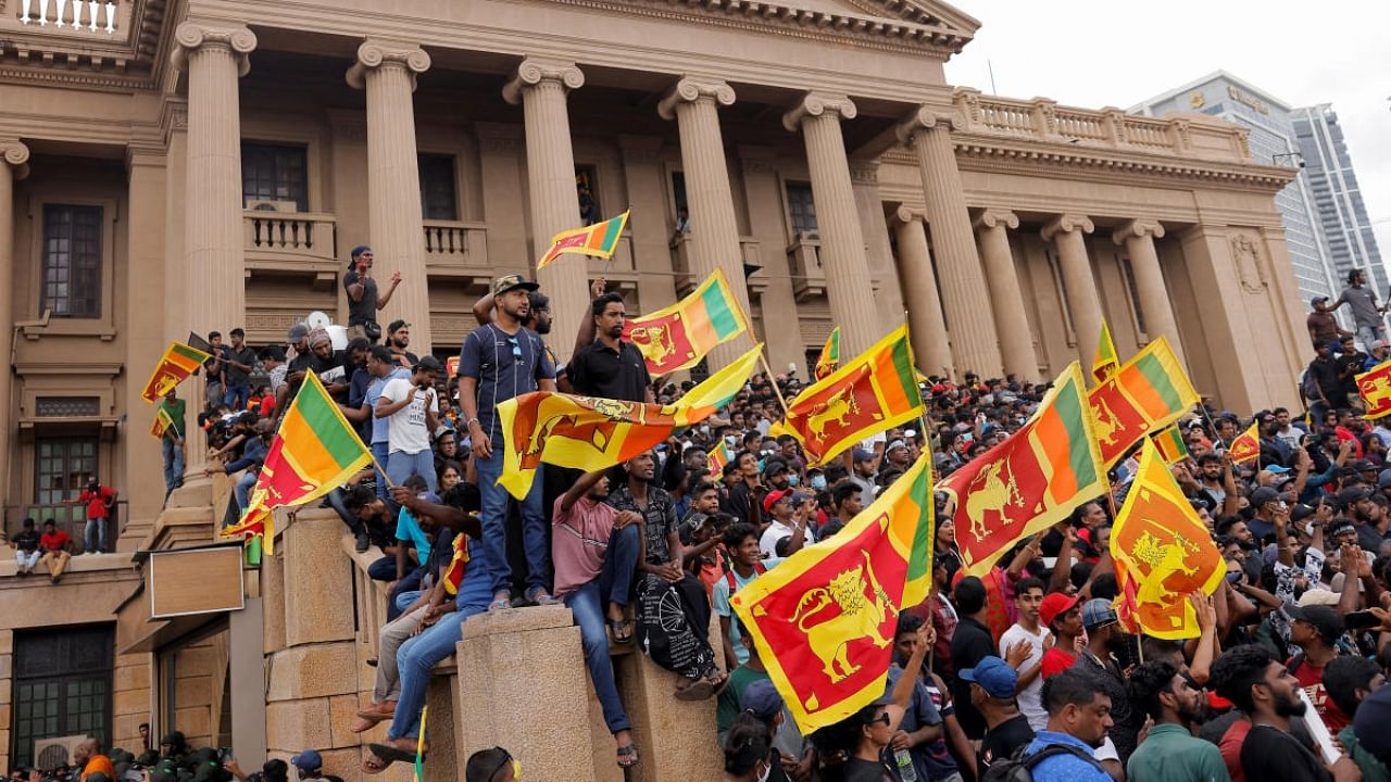 Demonstrators celebrate after entering the Presidential Secretariat during a protest, after President Gotabaya Rajapaksa fled, amid the country's economic crisis, in Colombo. Credit: Reuters Photo