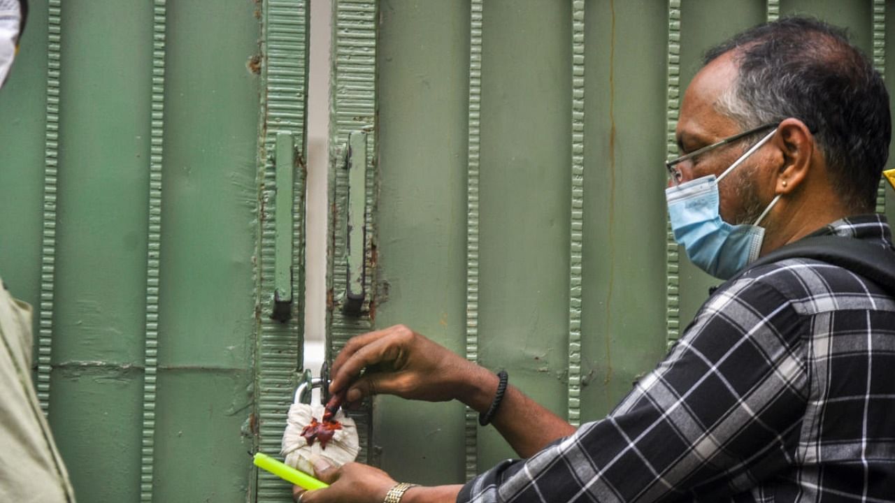 AIADMK office being sealed after two groups of suspected AIADMK workers clashed outside the party headquarters in Chennai, Monday, July 11, 2022. Credit: PTI Photo