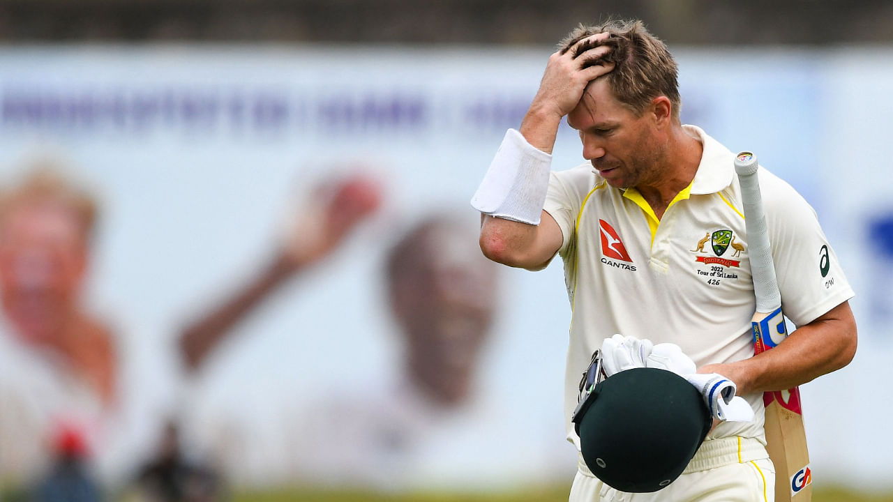 Veteran Australian cricketer David Warner walks away after his dismissal during the fourth day of the second Test against Sri Lanka on July 11, 2022. Credit: AFP File Photo
