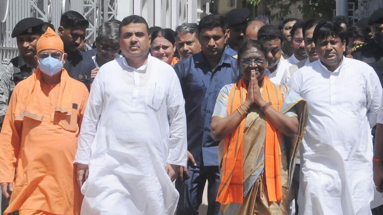 NDAs Presidential candidate Droupadi Murmu with the Opposition leader of West Bengal Legislative Assembly Suvendu Adhikary and other BJP State leaders, coming out from Swami Vivekananda's ancestral house after paying tribute, in Kolkata on Tuesday, July 12, 2022. Credit: IANS Photo