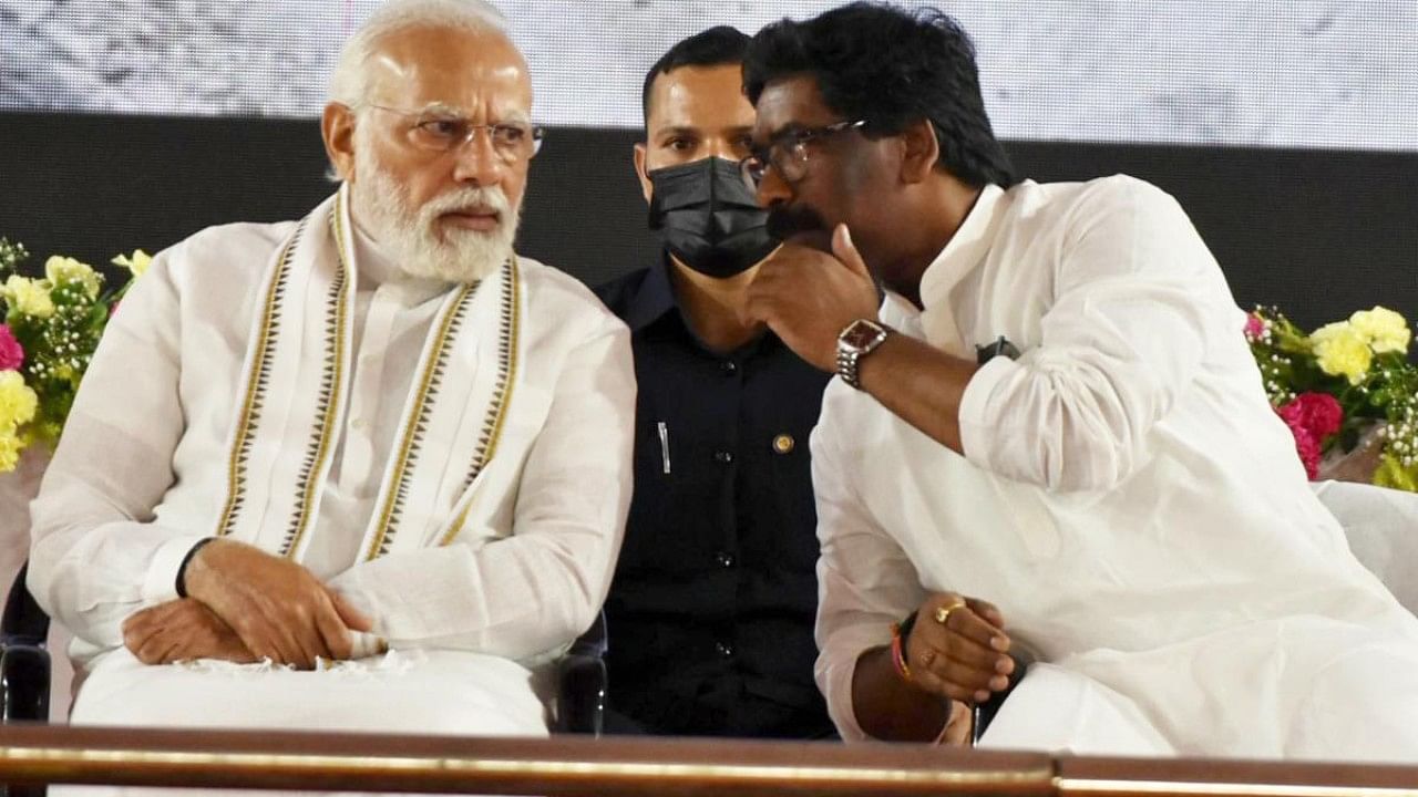 Prime Minister Narendra Modi in a conversation with Jharkhand CM Hemant Soren during the inauguration of Deoghar Airport and other various development projects, in Deoghar on Tuesday, July 12, 2022. Credit: IANS