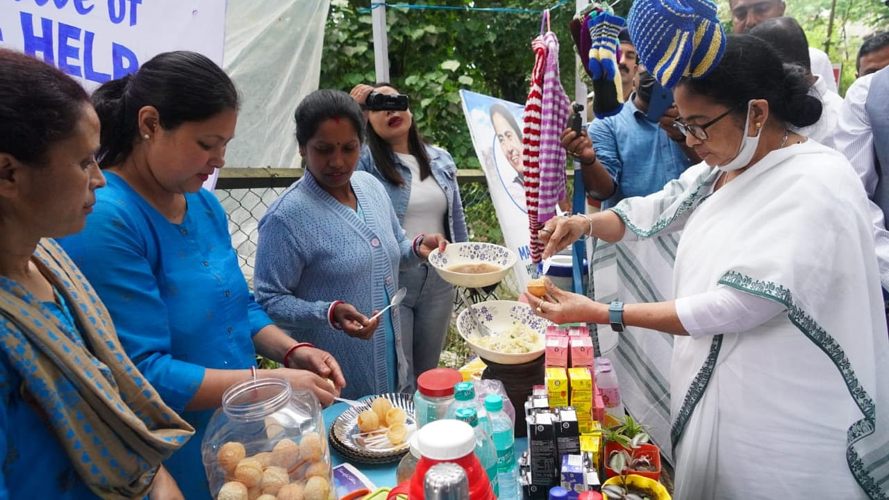 West Bengal CM Mamata Banerjee makes Gol Gappa to serve among children, during her visit to Darjeeling on Tuesday. Credit: IANS Photo