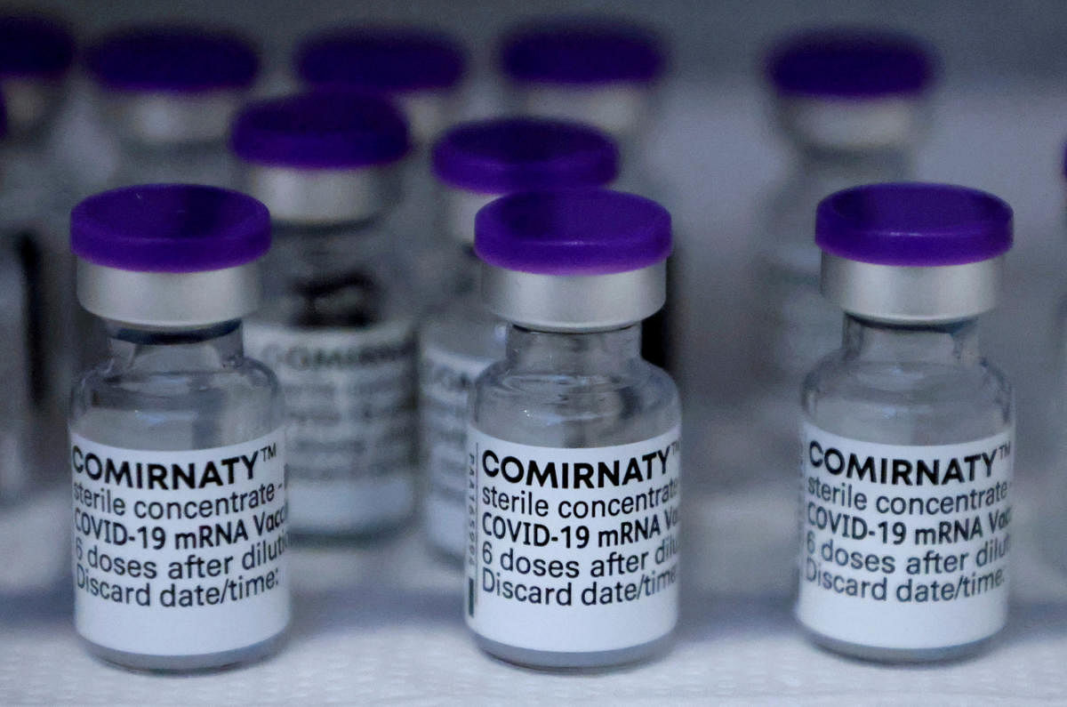 Vials of the Pfizer-BioNTech Comirnaty coronavirus disease (COVID-19) vaccine are pictured in a General practitioners practice. Credit: Reuters Photo